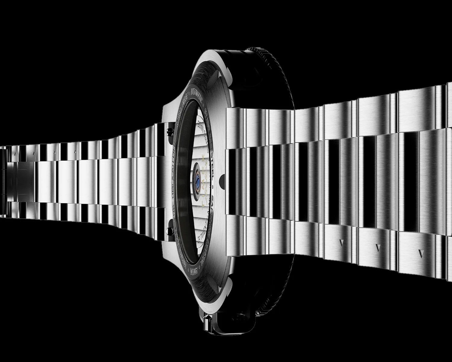 Stainless steel watch bracelet with a brushed finish, shown from the side with the watch case back visible. The watch case back has a transparent center revealing the automatic movement inside, surrounded by engraved text. The background is black, highlighting the metallic texture and details of the bracelet and case.