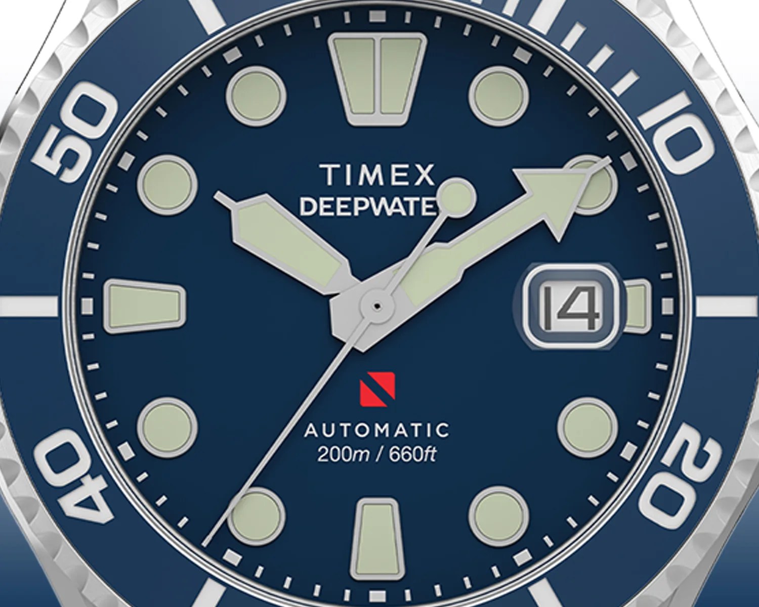 Close-up of a Timex Deepwater watch face with a blue dial and silver bezel. The watch features large luminescent hour markers and hands, a date window at the 3 o'clock position displaying the number 4, and a red diving flag symbol above the text "AUTOMATIC 200m / 660ft." The bezel has white numerals and markers for elapsed time.