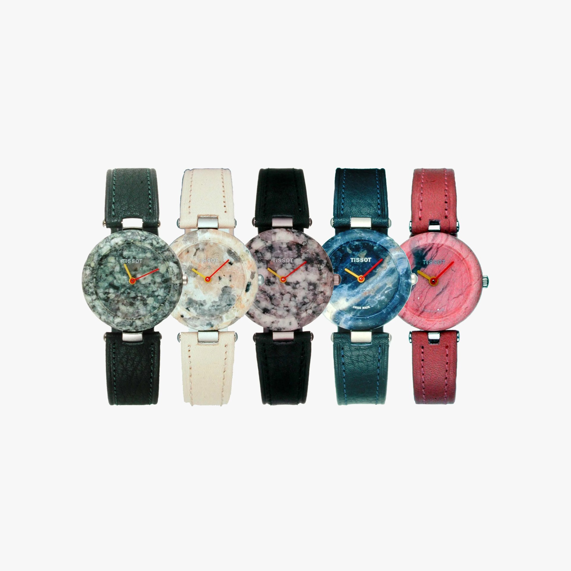 Five wristwatches with round, marble-patterned faces in different colors: green, beige, pink, blue, and red. Each watch has a matching leather strap in dark green, cream, black, blue, and red respectively. The watch hands are yellow and red, and the brand name "TISSOT" is visible on the faces.