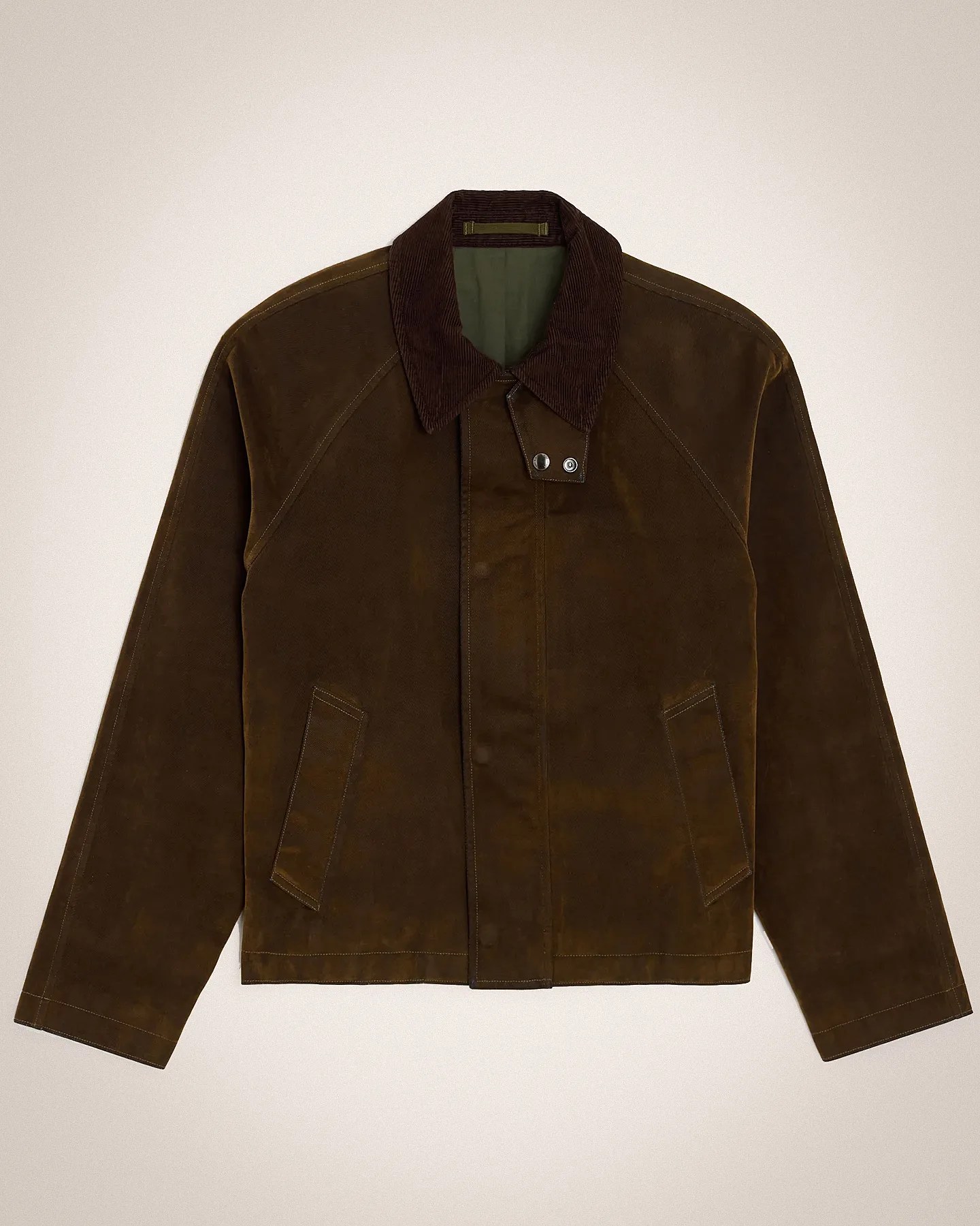 Brown suede jacket with a dark brown corduroy collar, front snap button closure, and two angled front pockets. The jacket has long sleeves and visible stitching details. The interior lining is olive green.