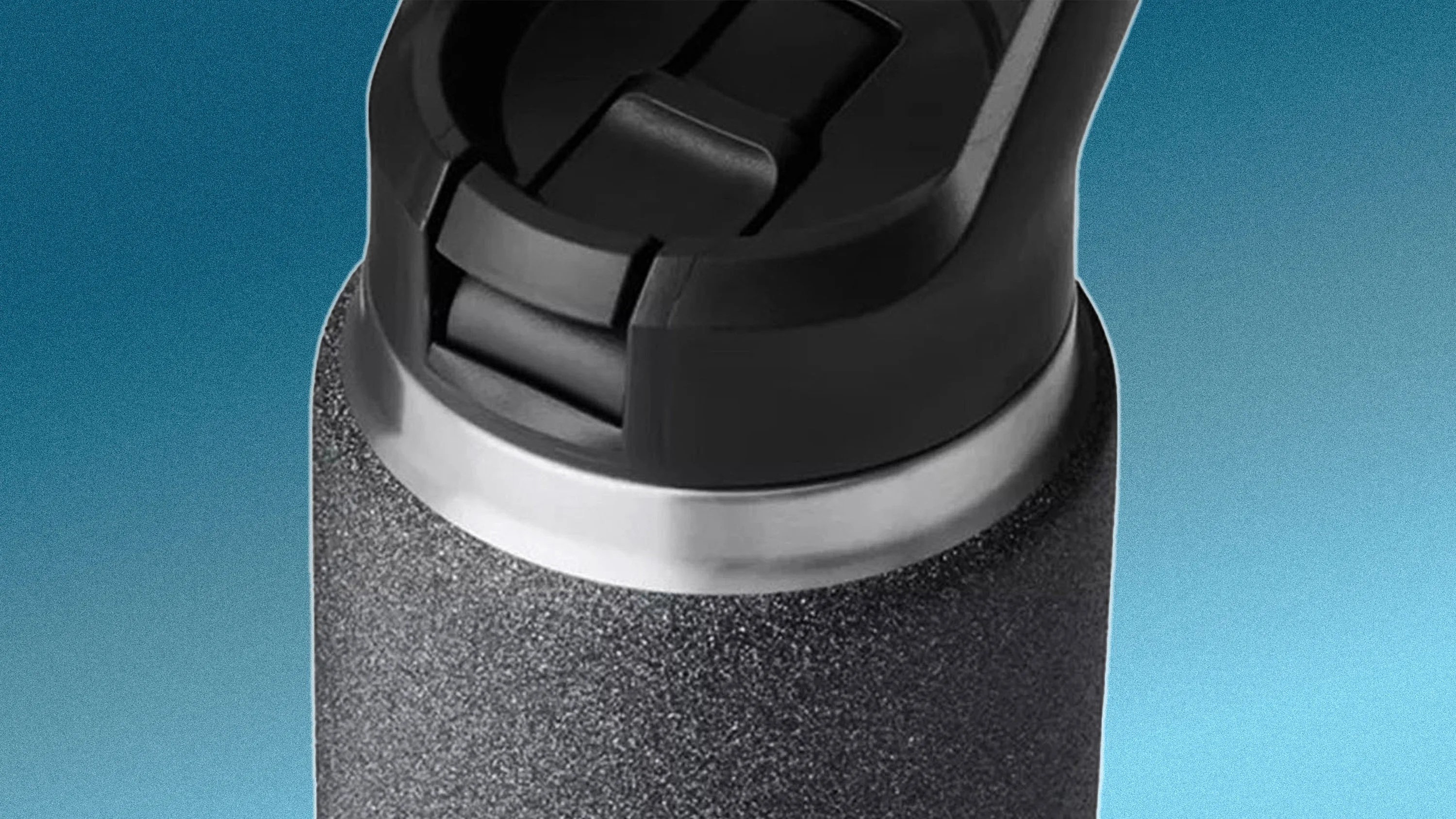 Close-up of the top portion of a textured black and silver insulated water bottle with a black flip-top lid against a gradient blue background.
