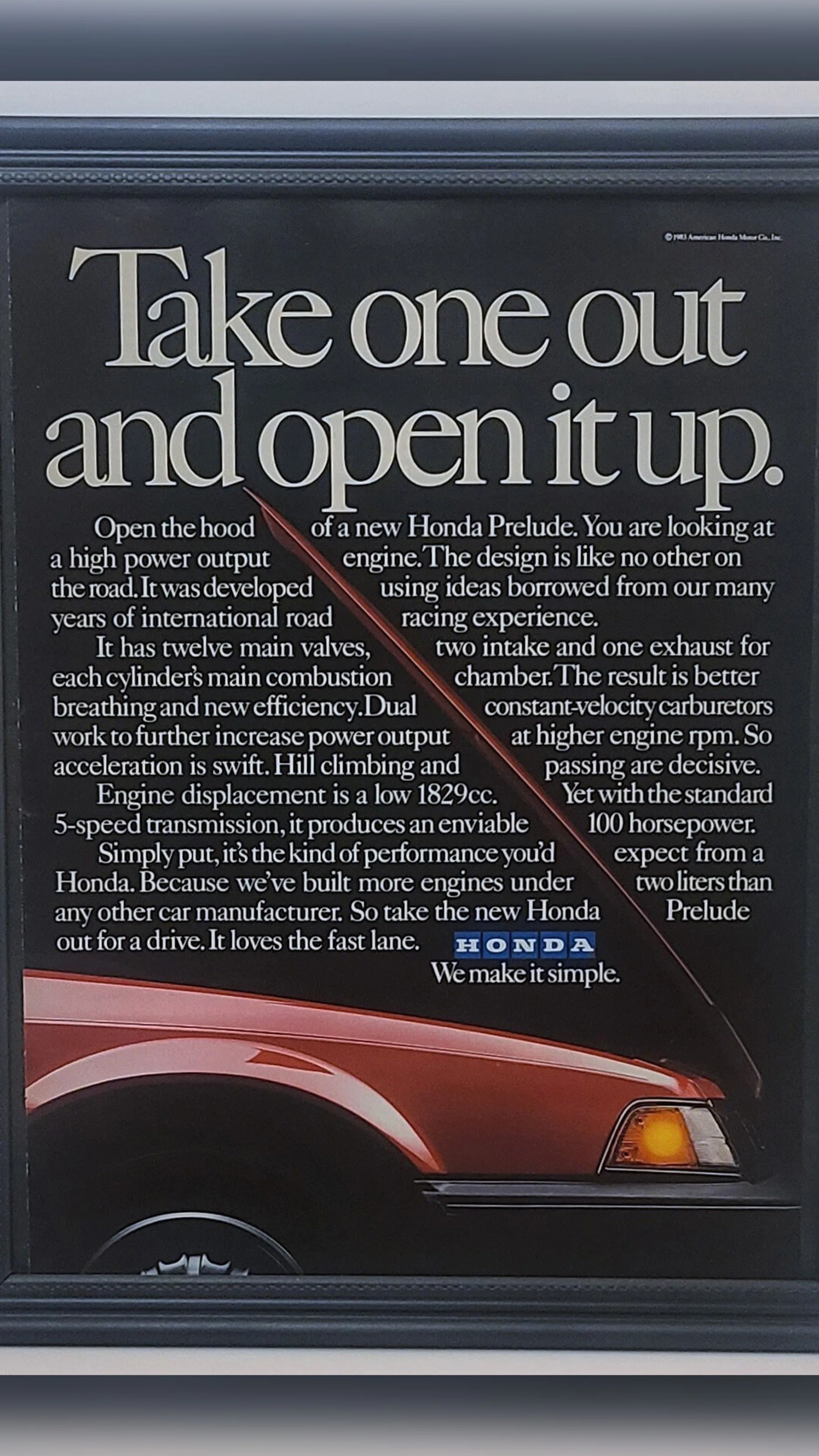 Vintage Honda Prelude car advertisement with detailed engine and performance description on a black background above a red car hood.