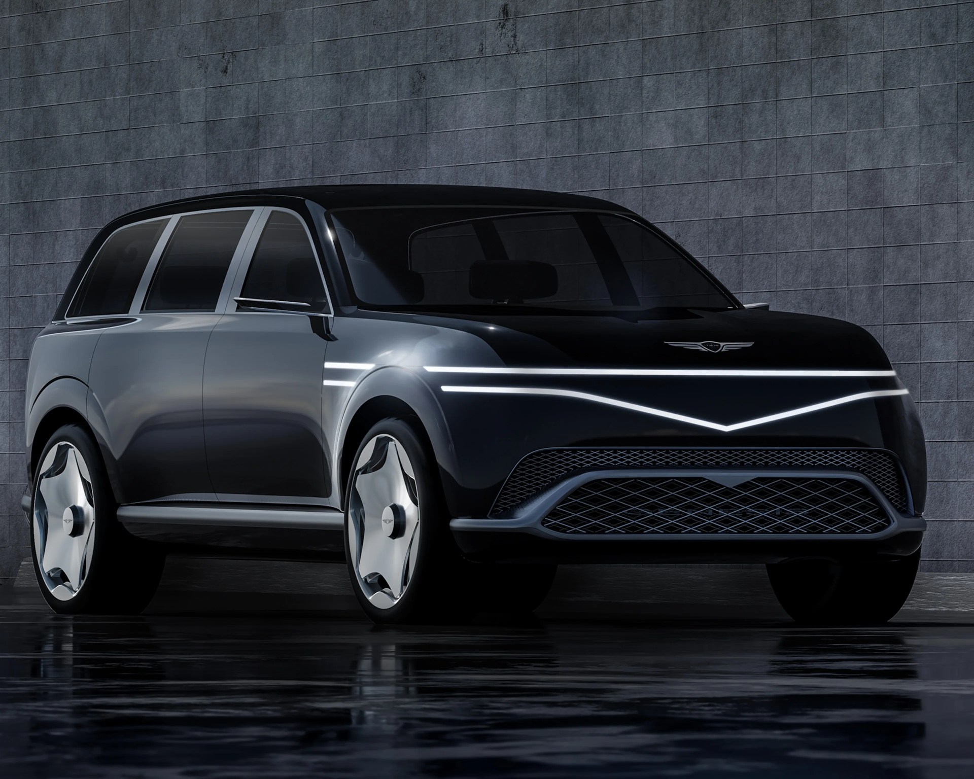 Glossy black luxury SUV with sleek LED light strip and futuristic wheel design parked against a tiled wall.