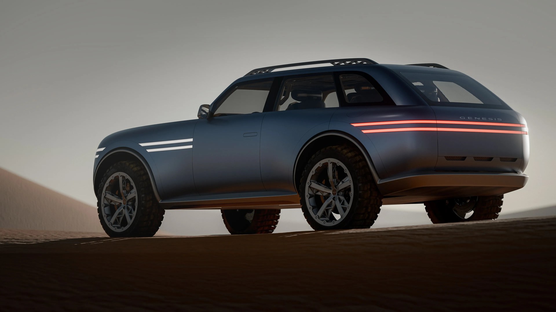 Matte blue Genesis SUV with off-road tires and horizontal LED light strips on desert sand.