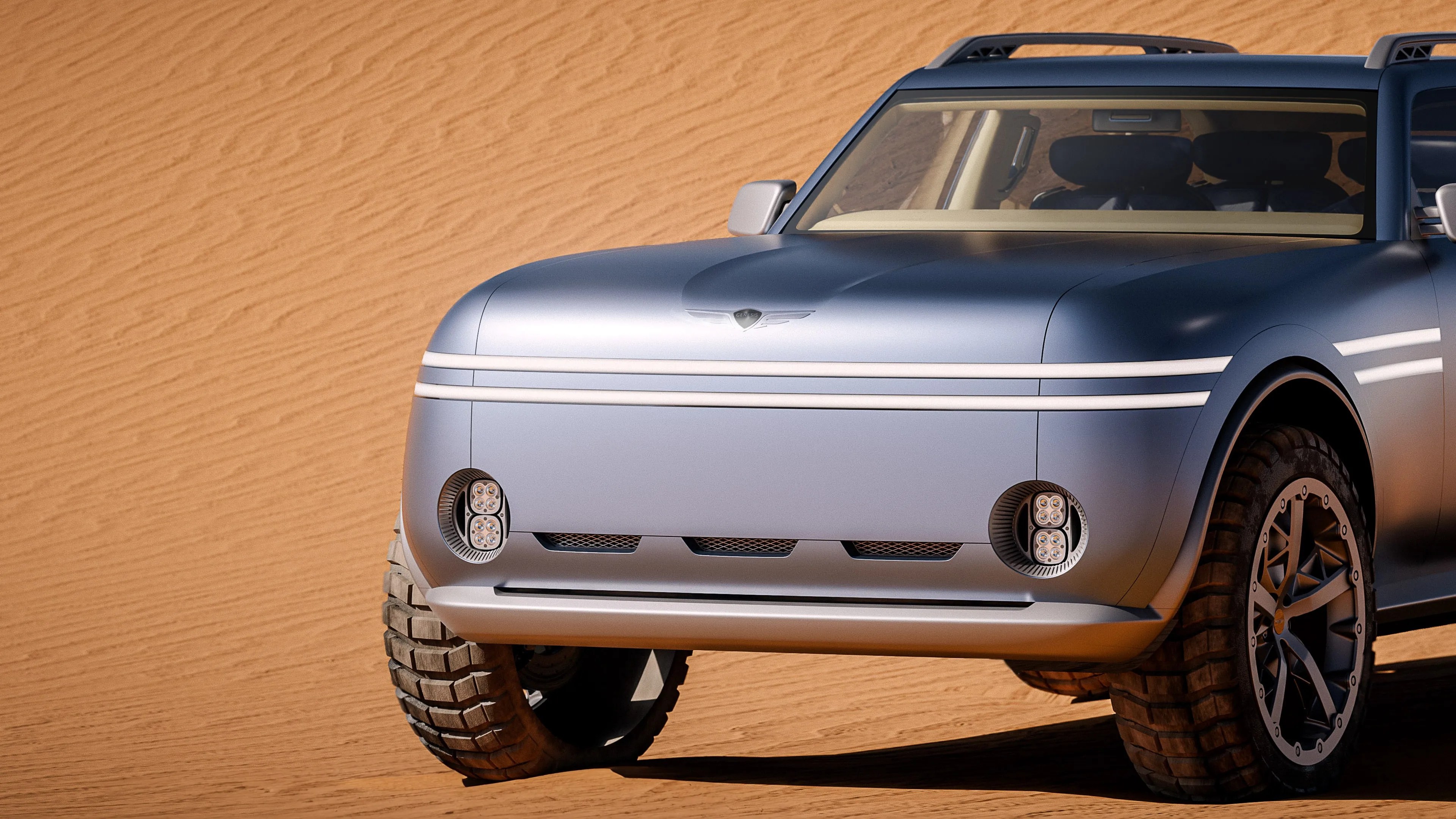Front view of a matte silver electric SUV with LED headlights and rugged off-road tires on sand dunes.