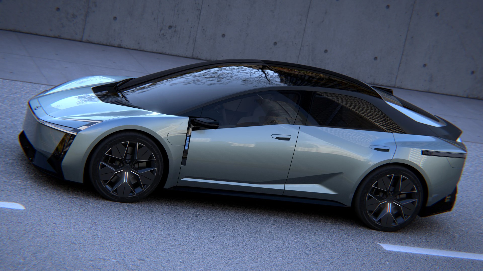 Sleek silver electric sedan with black roof and futuristic black alloy wheels parked on a street.