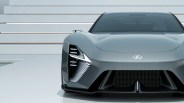 Front view of a sleek gray Lexus sports car with distinctive angular headlights and a large black grille.