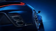 Rear side view of a blue sports car with illuminated red taillights and dual exhaust pipes.