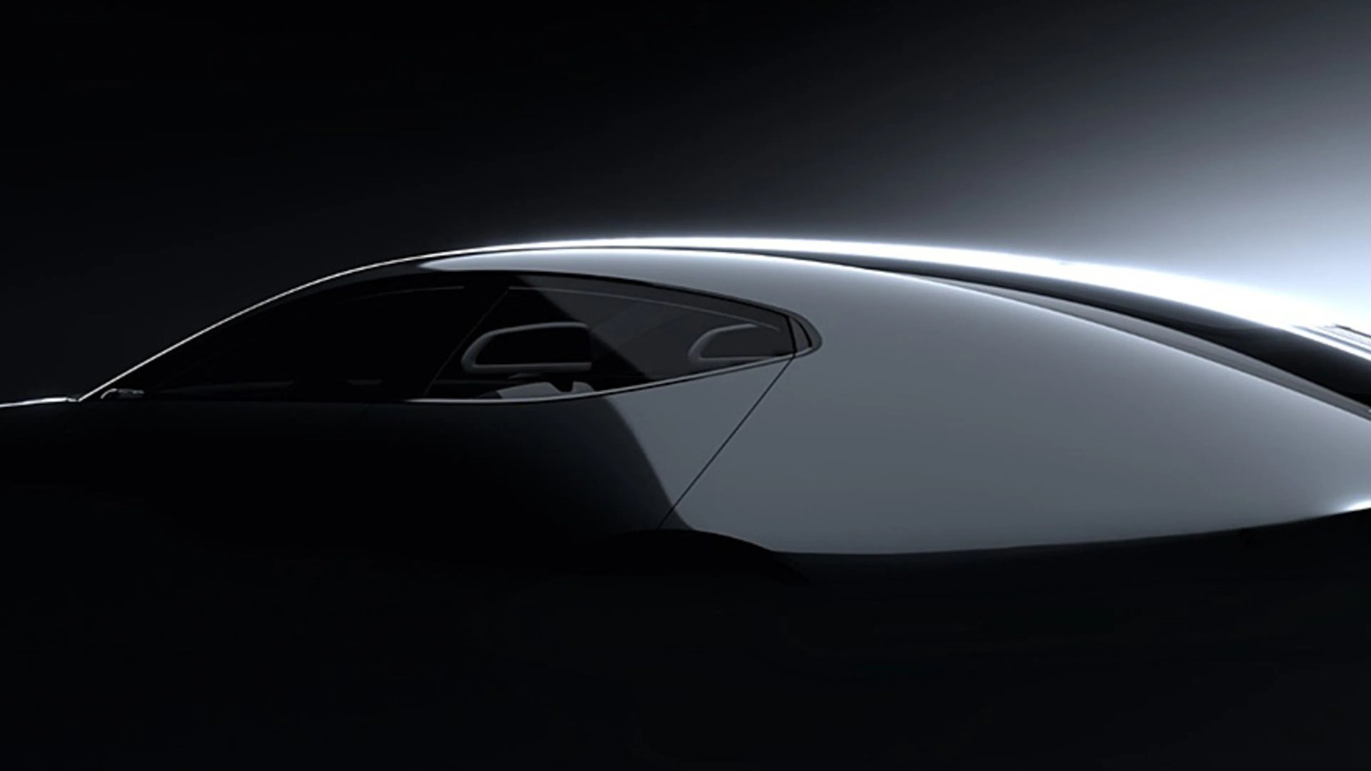 Sleek black sports car side profile with smooth curved roofline and tinted windows in low light.