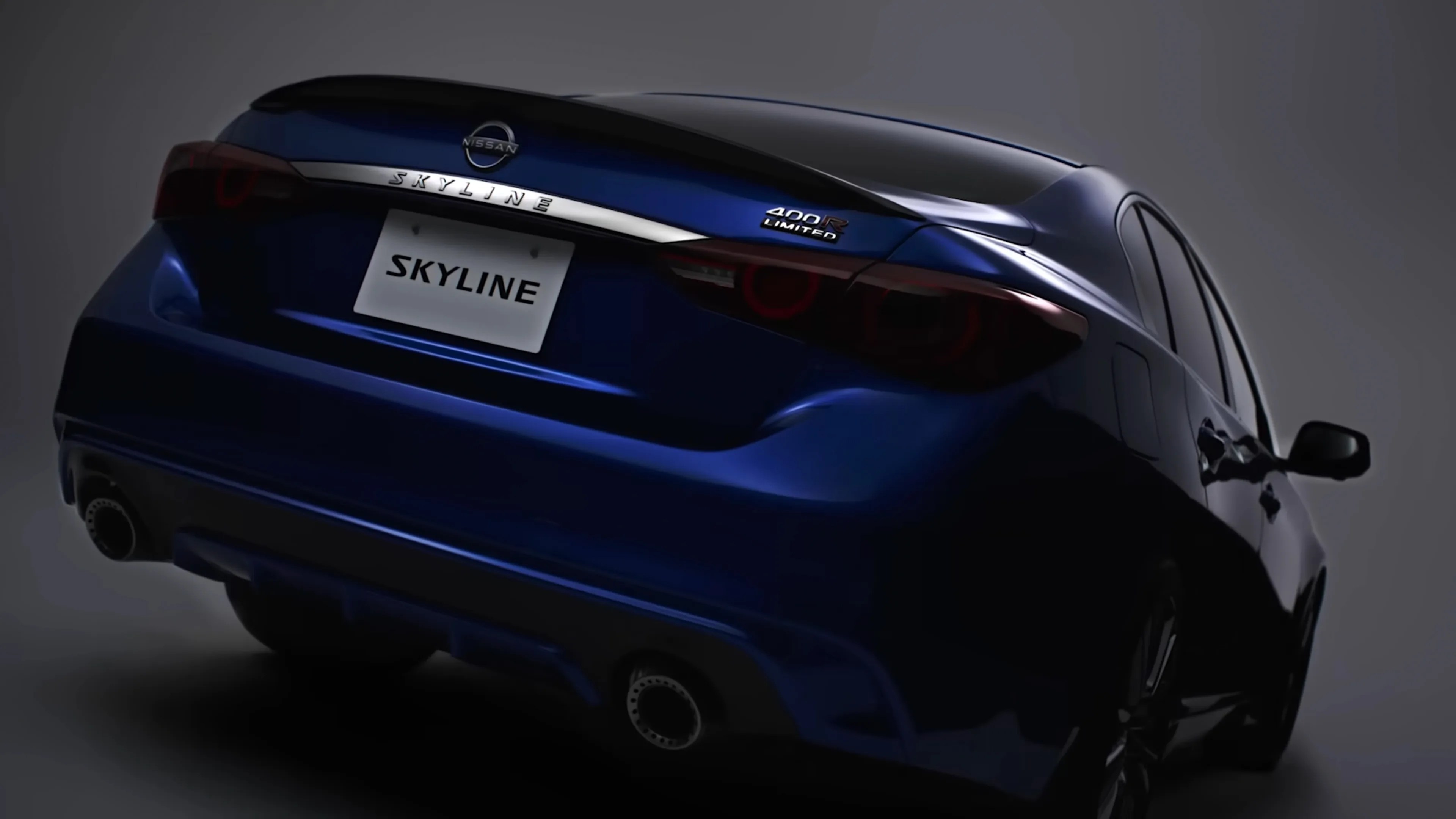 Rear view of a dark blue Nissan Skyline 400R Limited sedan with dual exhausts in a studio setting.