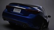 Rear view of a dark blue Nissan Skyline 400R Limited sedan with dual exhausts in a studio setting.