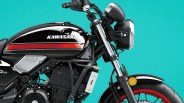 Black Kawasaki motorcycle fuel tank with red stripe and red front wheel against a turquoise background.