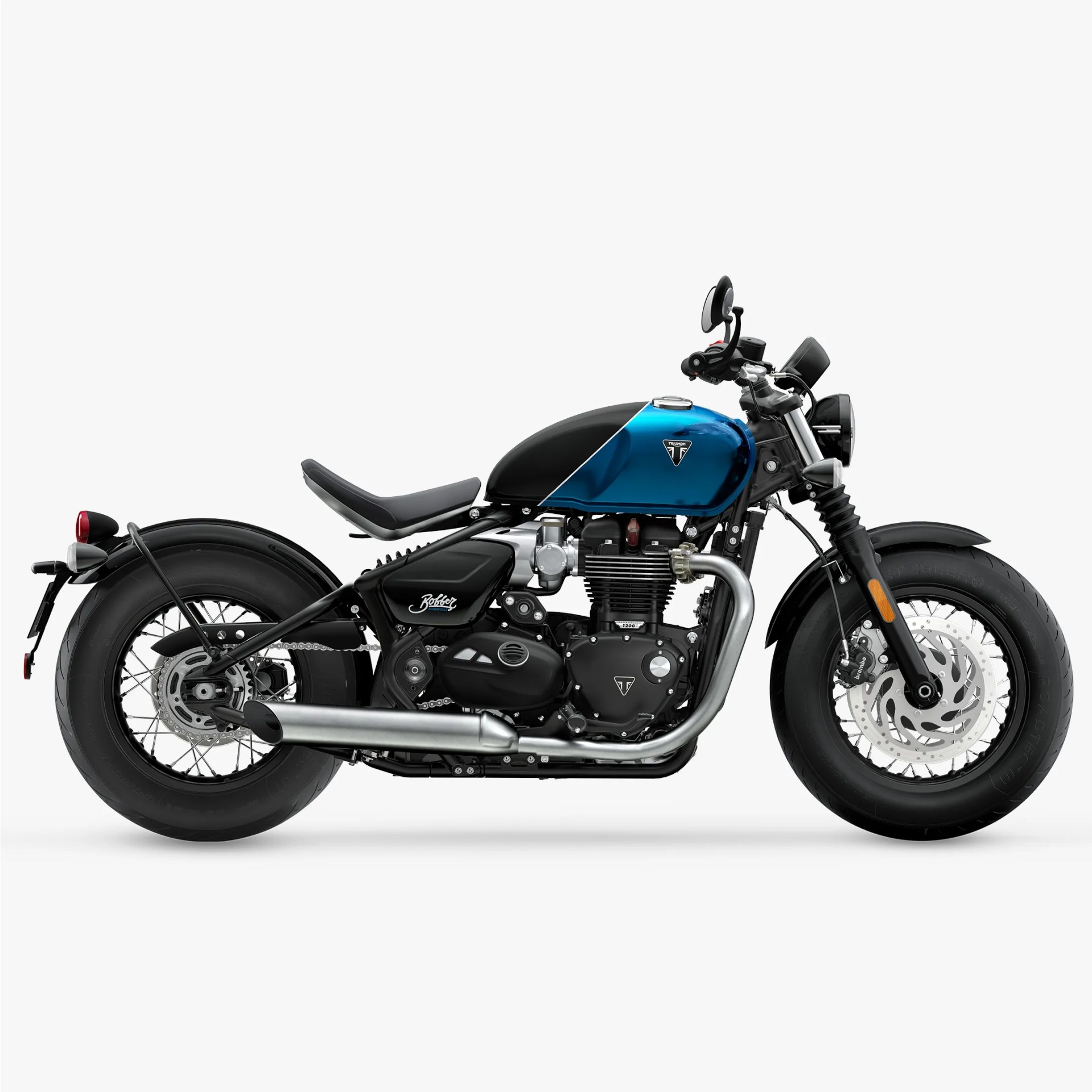 Black and blue Triumph Bobber motorcycle with chrome exhaust and thick tires on a white background.