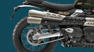 Rear section of a black and silver Triumph Scrambler 900 motorcycle showing exhaust pipes, rear wheel, and seat.