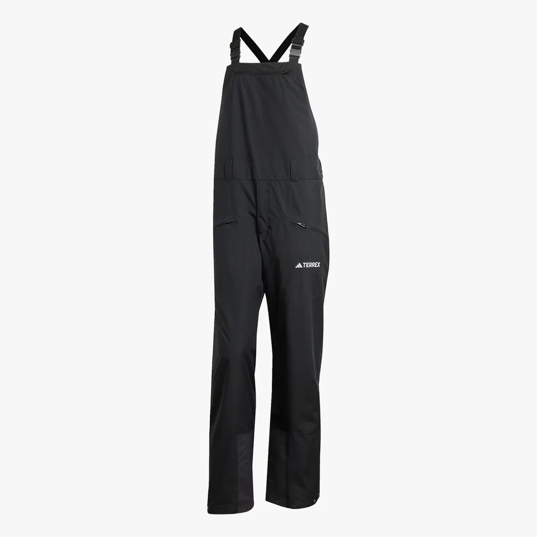 Black waterproof bib pants with adjustable shoulder straps and zippered pockets, featuring the Terrex logo.