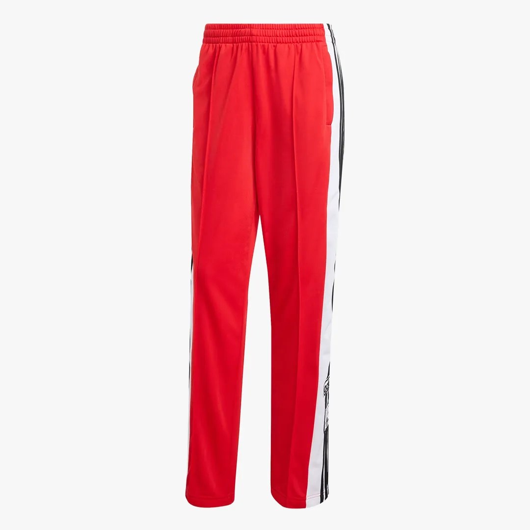 Red track pants with white and black side stripes and an elastic waistband.