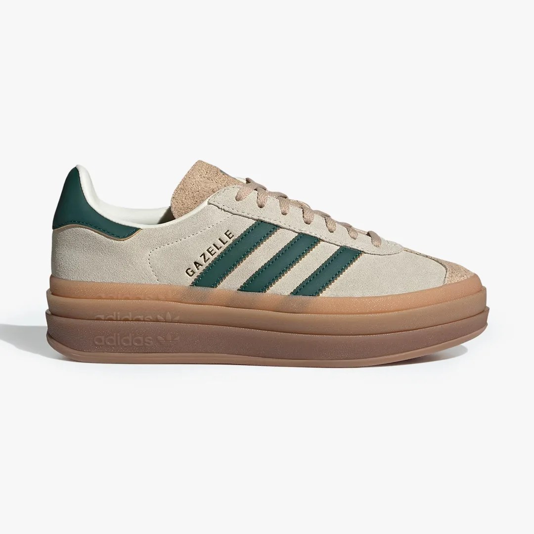 Beige suede Adidas Gazelle sneaker with dark green stripes and a thick layered gum sole.