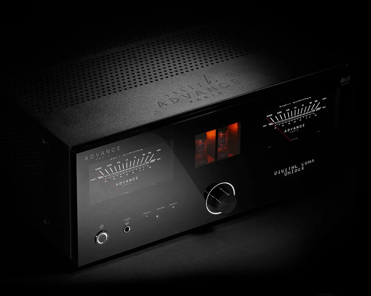 Black Advance Paris audio amplifier with illuminated analog meters, control knob, and visible glowing tubes.