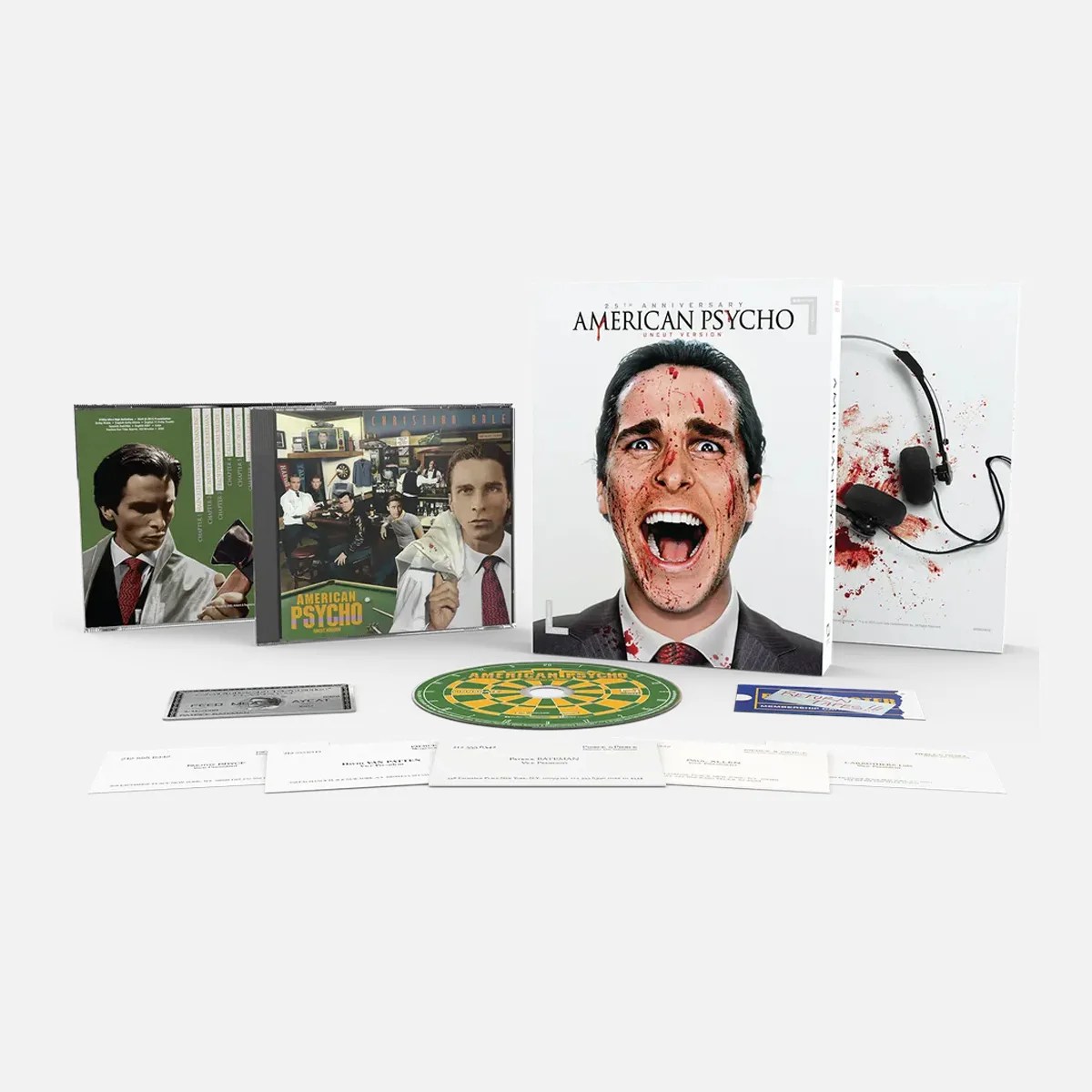 25th Anniversary American Psycho collector's edition set with DVD cases, booklet, dartboard, and cards.