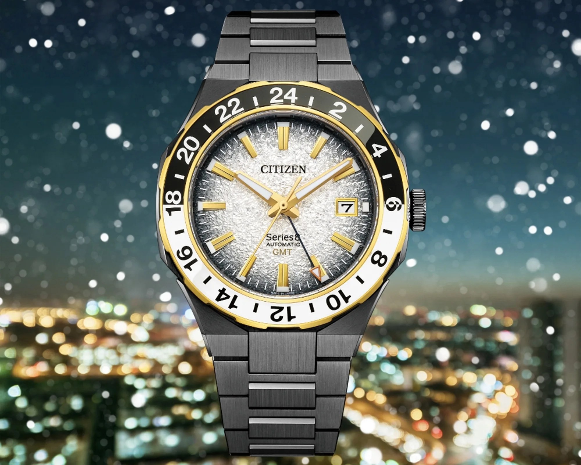 Citizen Series 8 automatic GMT watch with textured silver dial, gold accents, black and white 24-hour bezel, and stainless steel bracelet.