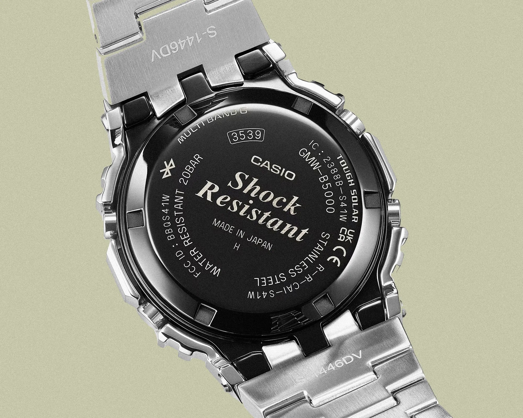 Back of a Casio GMW-B5000 stainless steel shock-resistant watch with metal bracelet.