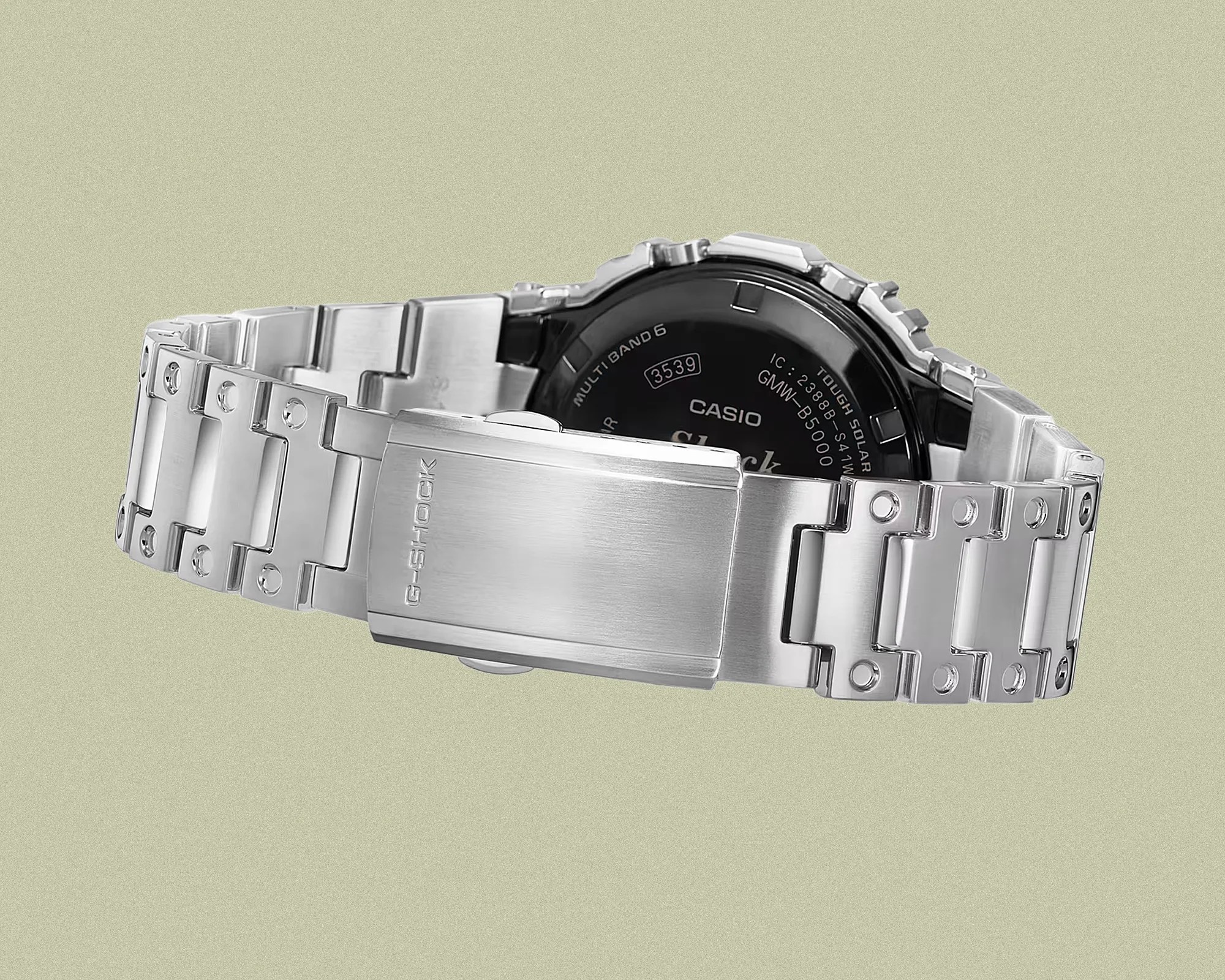 Silver metal link bracelet with a clasp engraved "G-SHOCK" on the back of a Casio watch.