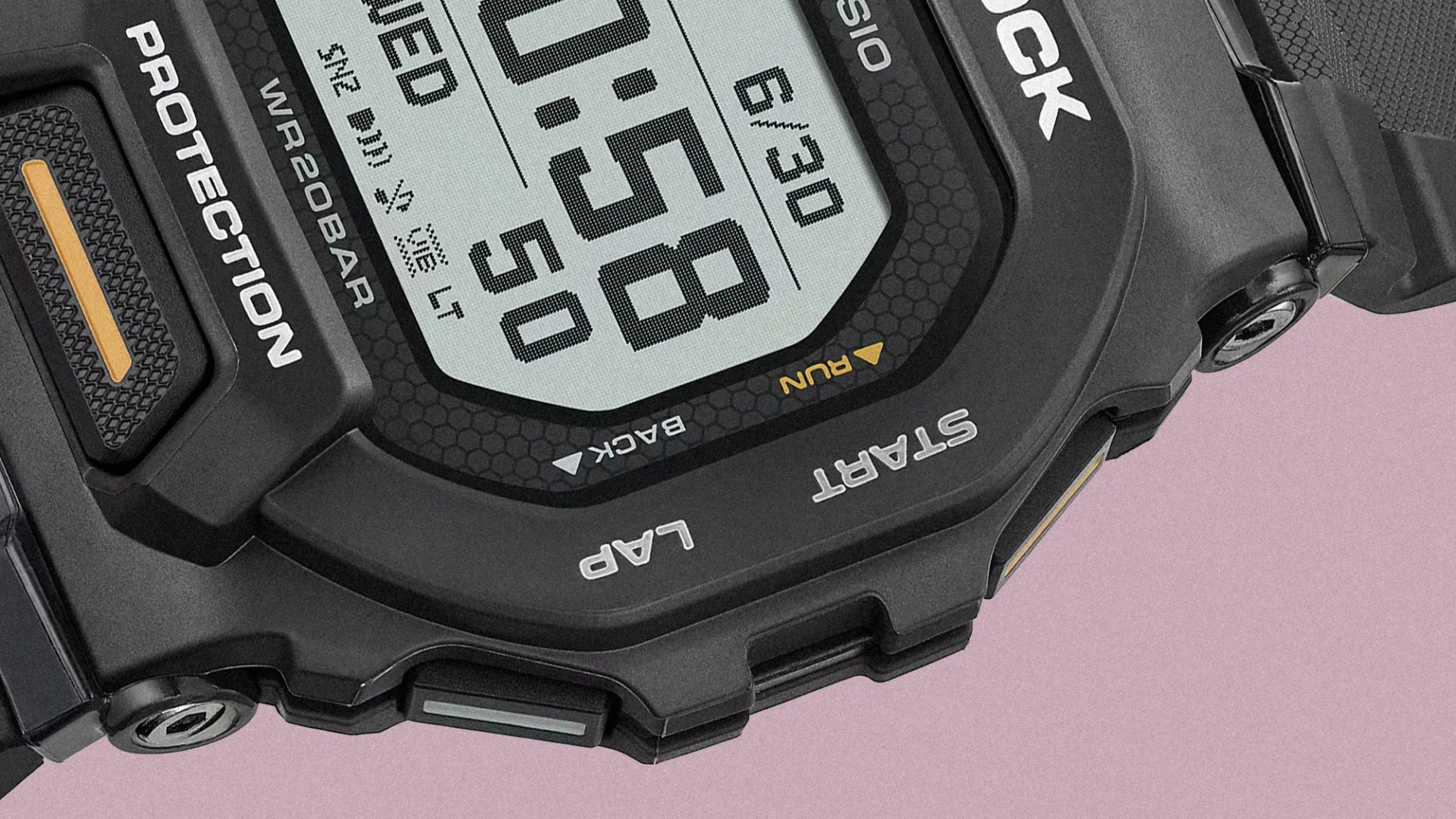 Close-up of a black Casio G-Shock digital watch face showing time, date, and buttons labeled Protection, Start, and Lap.