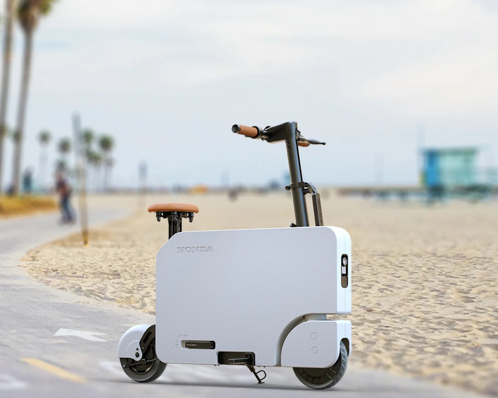 Compact white Honda electric scooter with brown seat and handle grips on a beachside path.