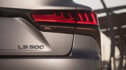 Rear view of a silver Lexus LS 500 showing the taillight and model badge.