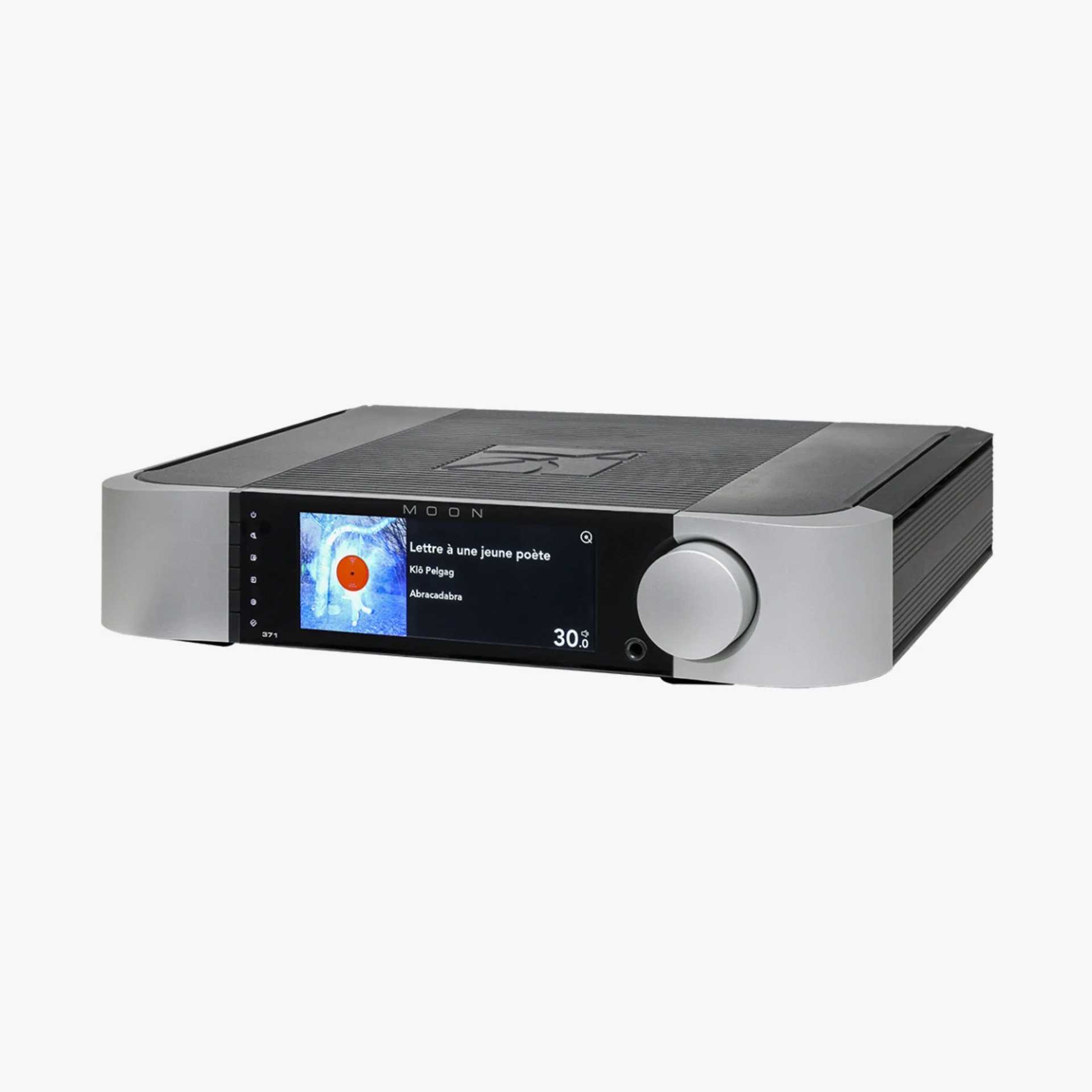 Silver and black MOON audio amplifier with digital display showing music track information and a large volume knob.