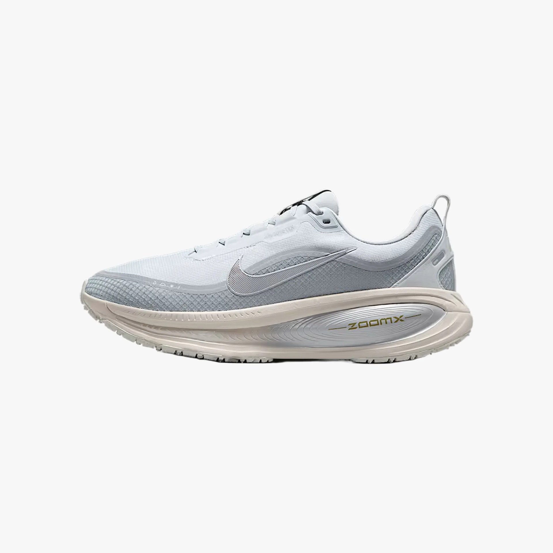 Light gray and white Nike ZoomX running shoe with beige cushioned sole and silver swoosh logo.