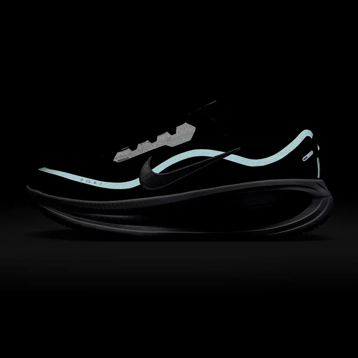 Black Nike running shoe with light blue reflective accents and a black swoosh logo on a dark background.