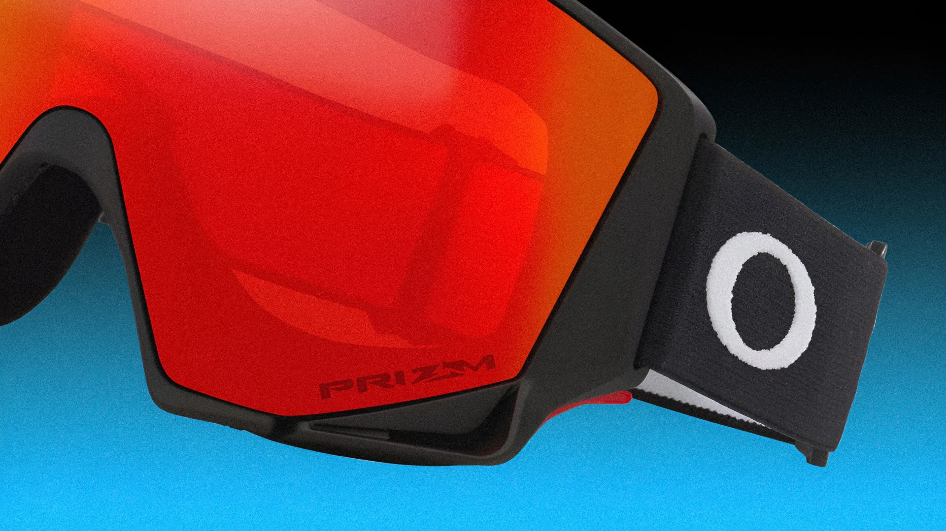Black-framed Oakley goggles with red Prizm lens and black strap featuring a white Oakley logo.