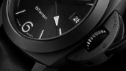 Close-up of a black BiTempo watch face showing the number 6, date window, and textured crown guard.