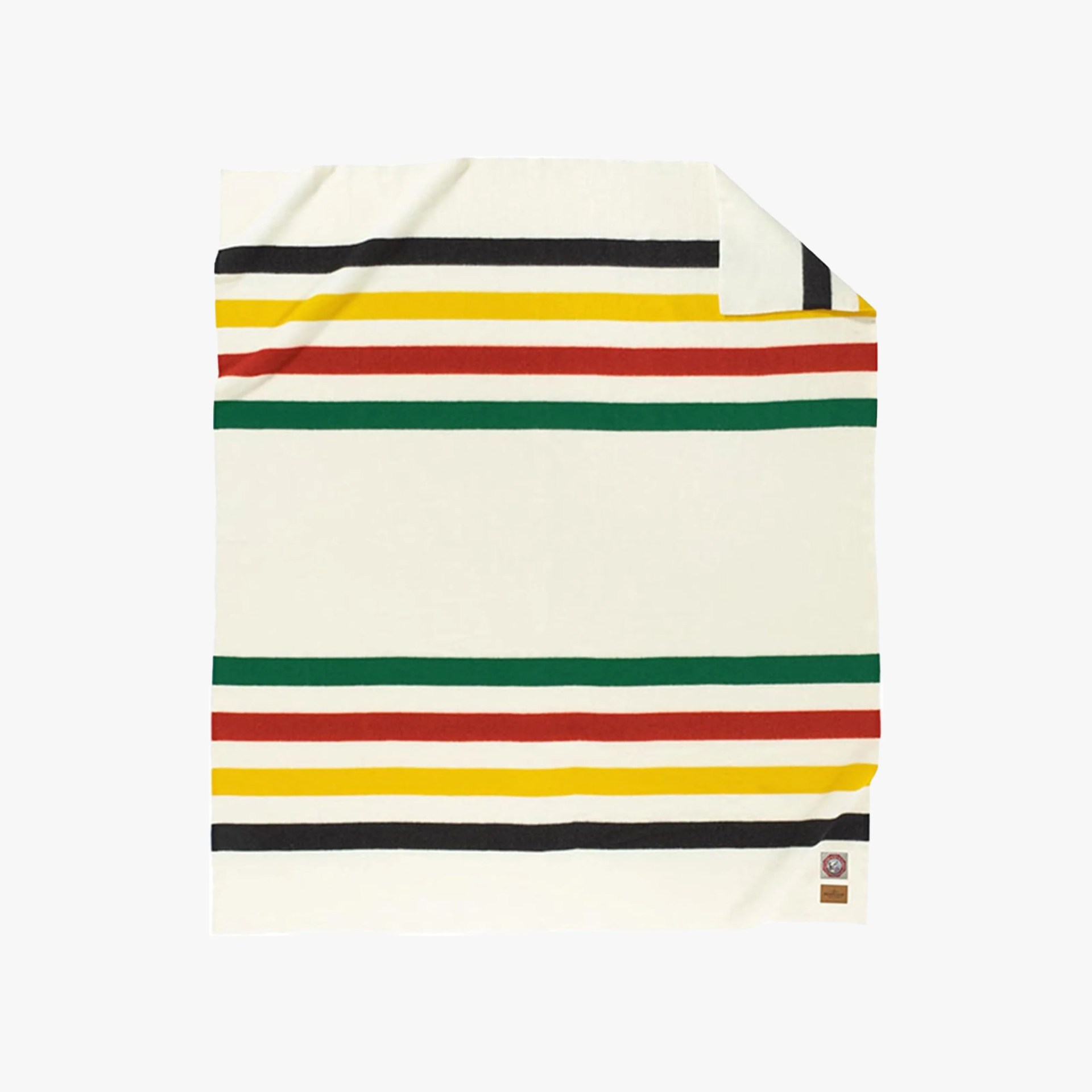 Cream-colored blanket with horizontal stripes in black, yellow, red, and green, folded at one corner.