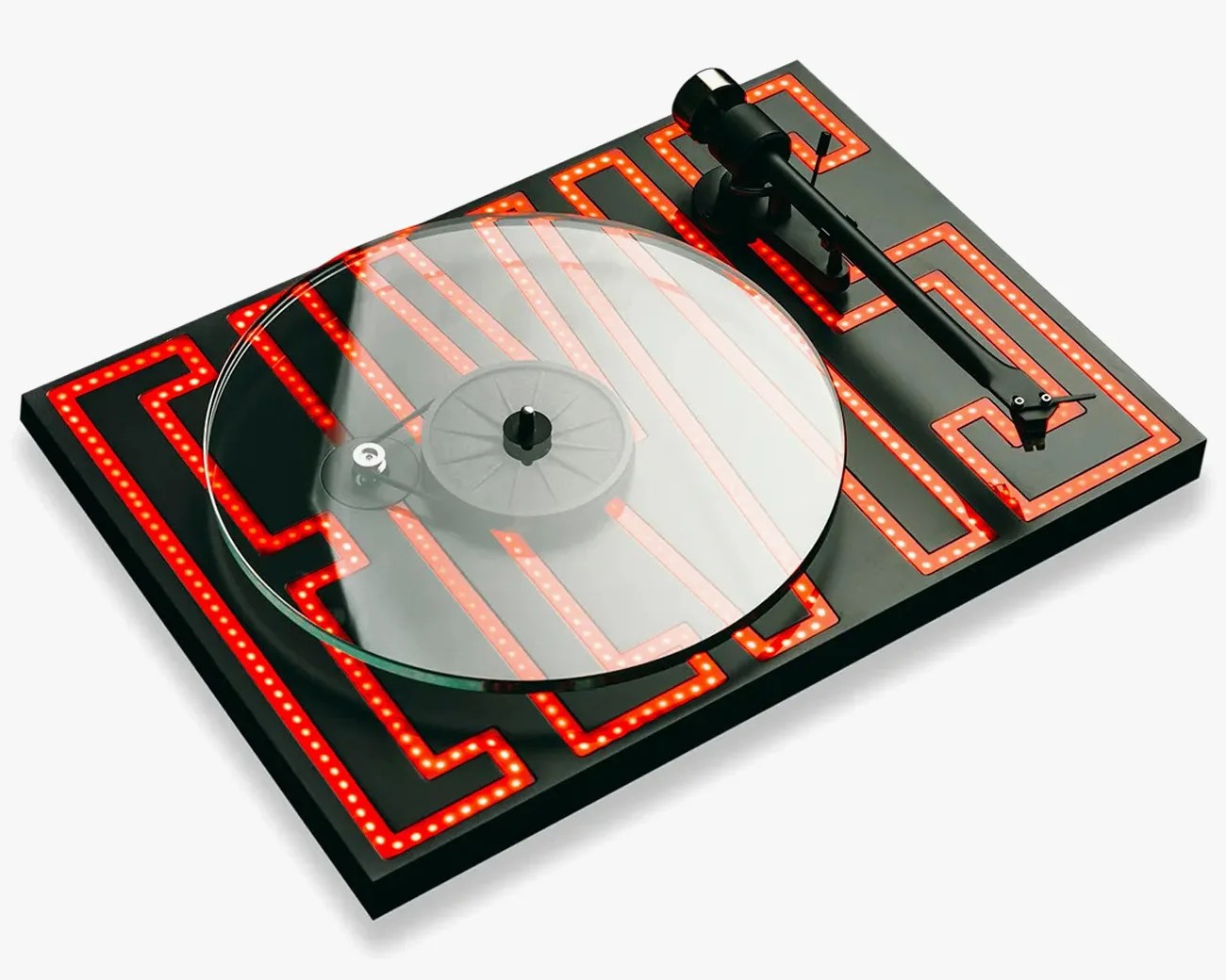 Black turntable with a transparent platter and red LED maze pattern on the base.