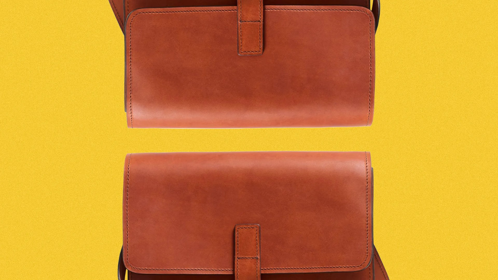 Two brown leather crossbody bags with flap closures on a yellow background.