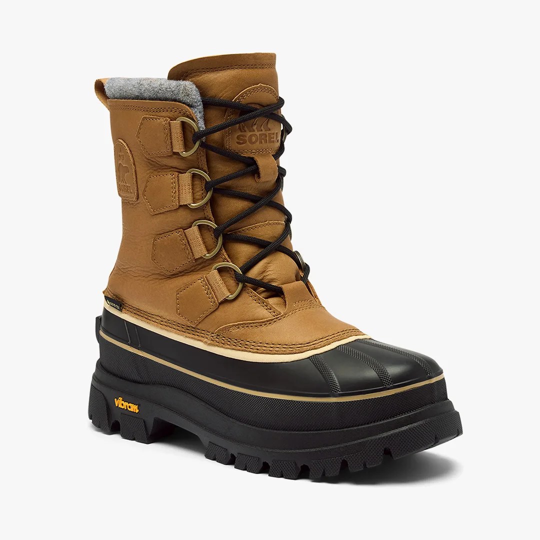 Brown leather and black rubber winter boot with black laces and Vibram sole.