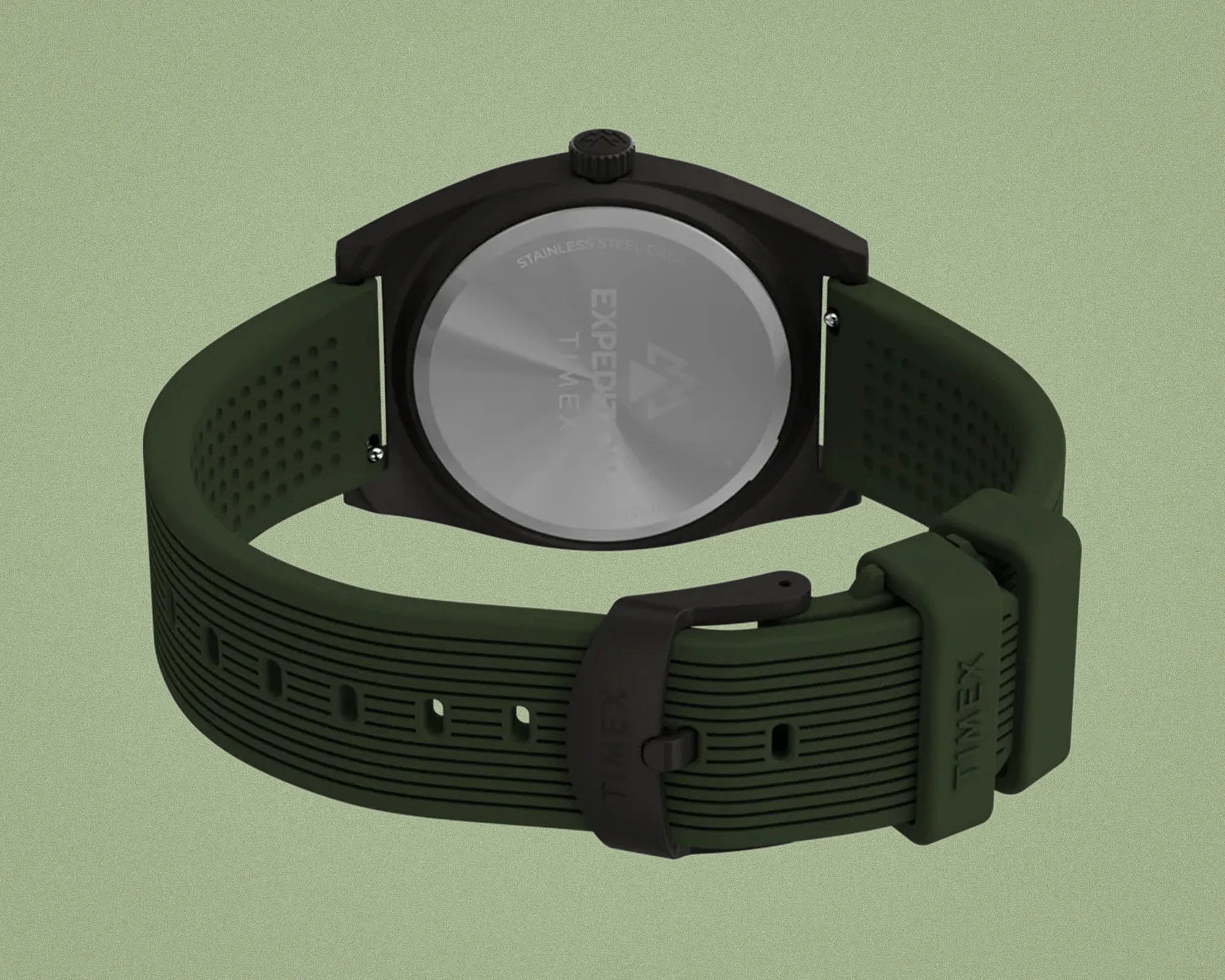 Green textured silicone watch strap with black buckle and stainless steel back case of Timex watch.
