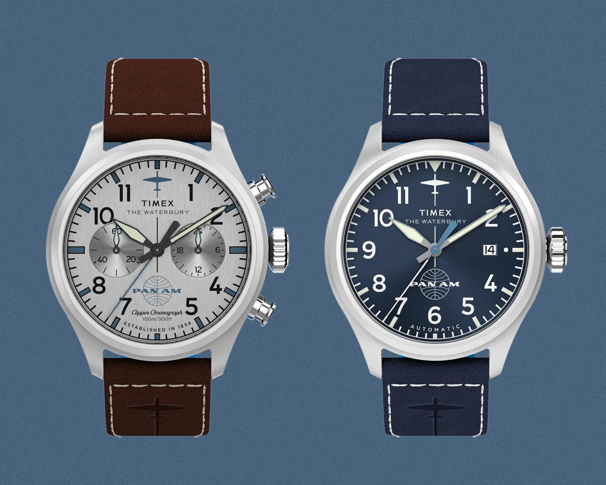 Two Timex Waterbury Pan Am watches side by side, one with a silver dial and brown leather strap, the other with a blue dial and blue leather strap.