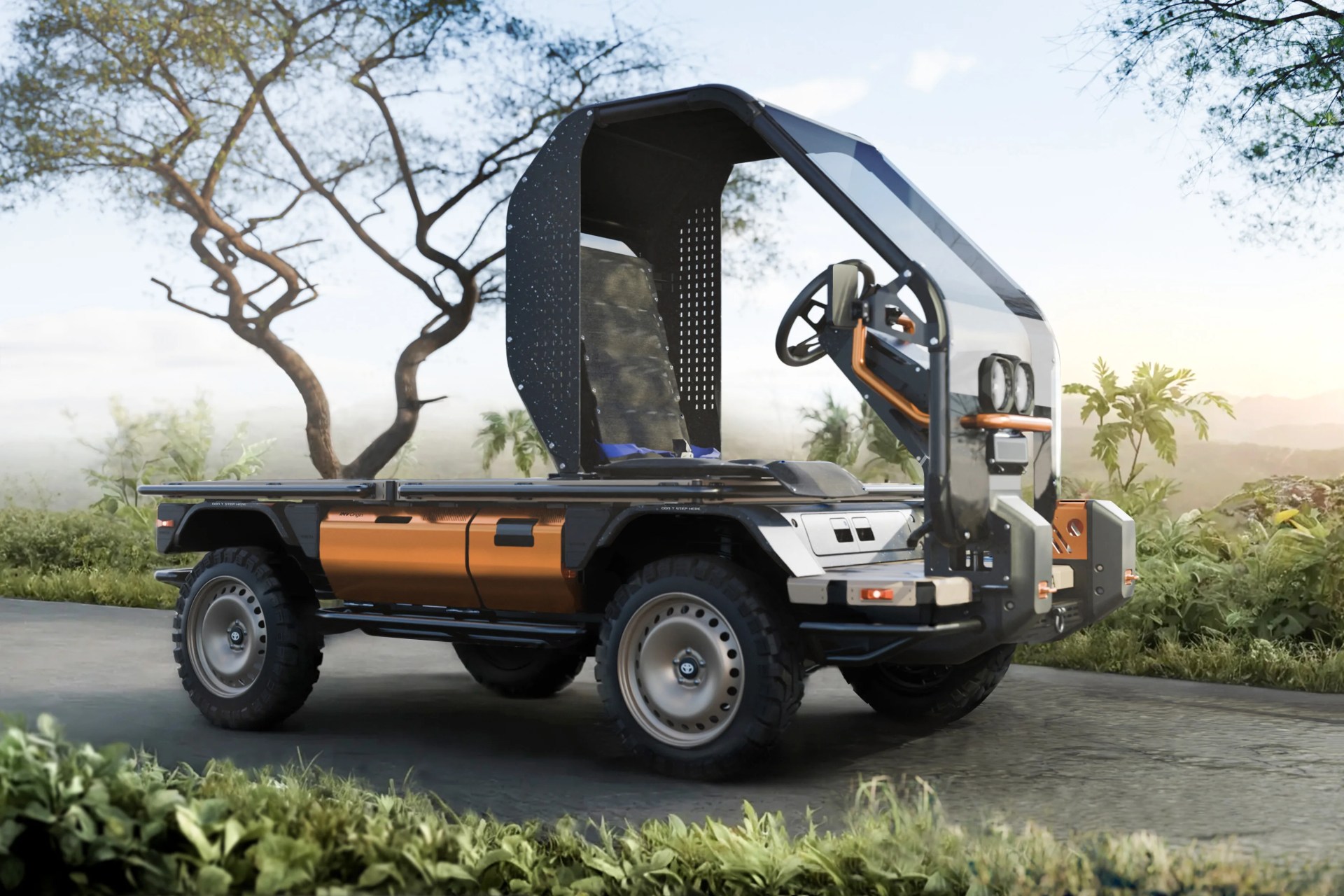 Compact off-road utility vehicle with orange and black body, single seat, and open cabin with windshield.
