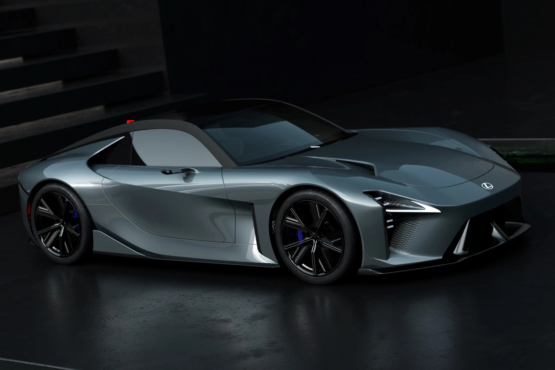 Sleek silver Lexus sports car with black roof and aerodynamic design on a dark reflective floor.