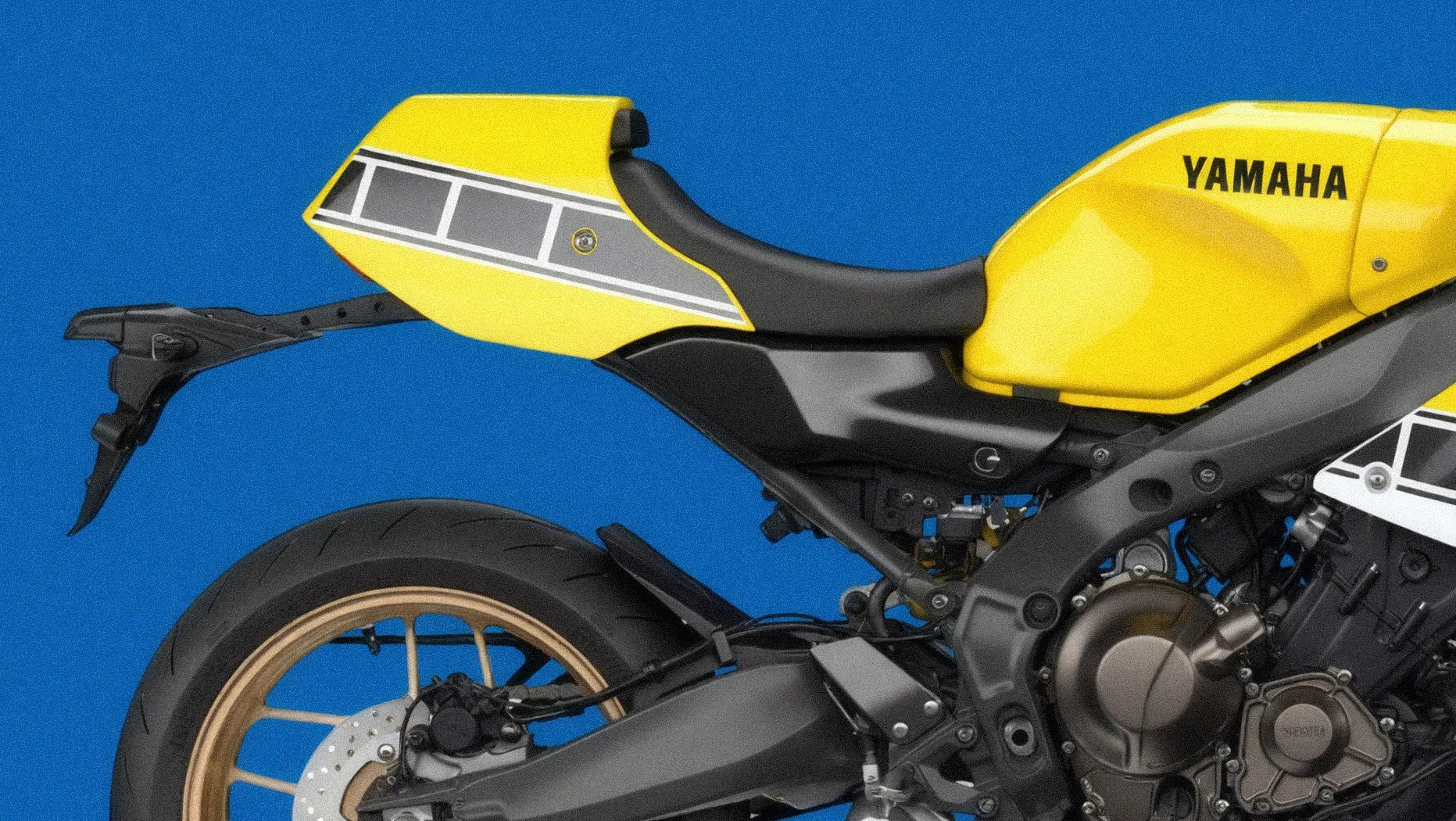 Yellow Yamaha motorcycle rear section with black seat and gold wheel against blue background.