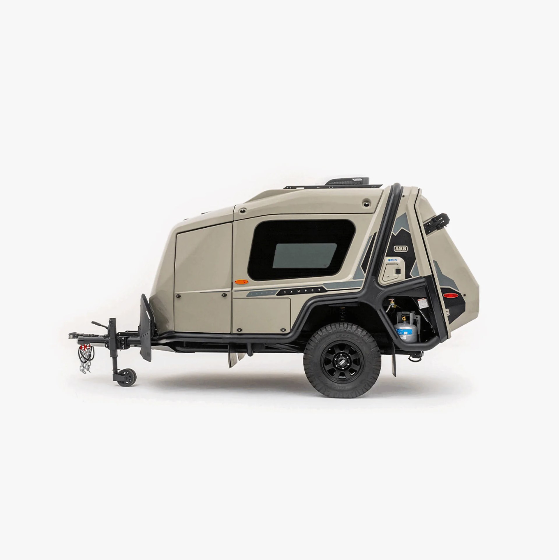Compact beige off-road camper trailer with black trim and single axle on white background.