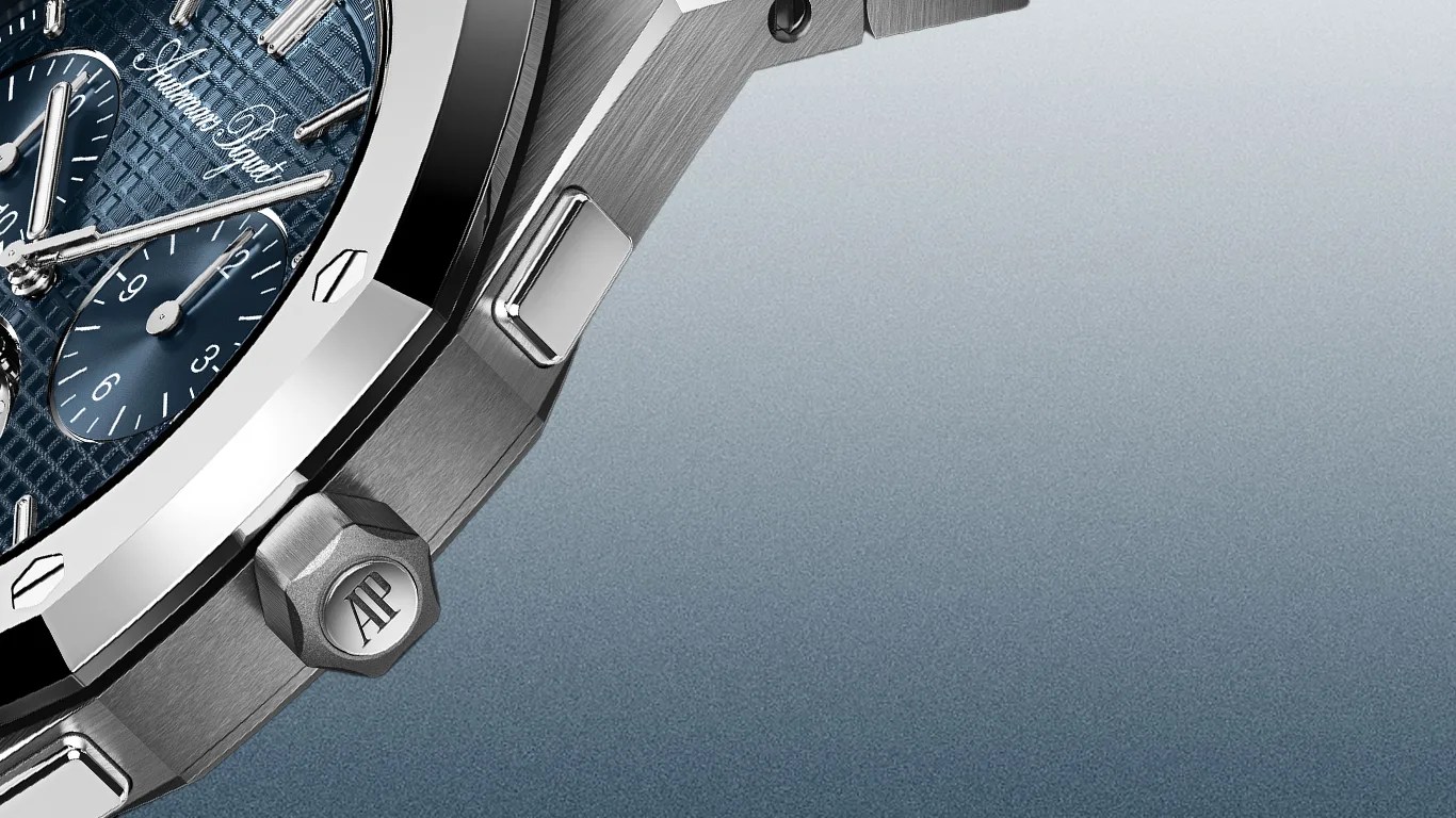 Close-up of a silver Audemars Piguet watch with a blue textured dial and chronograph subdials.