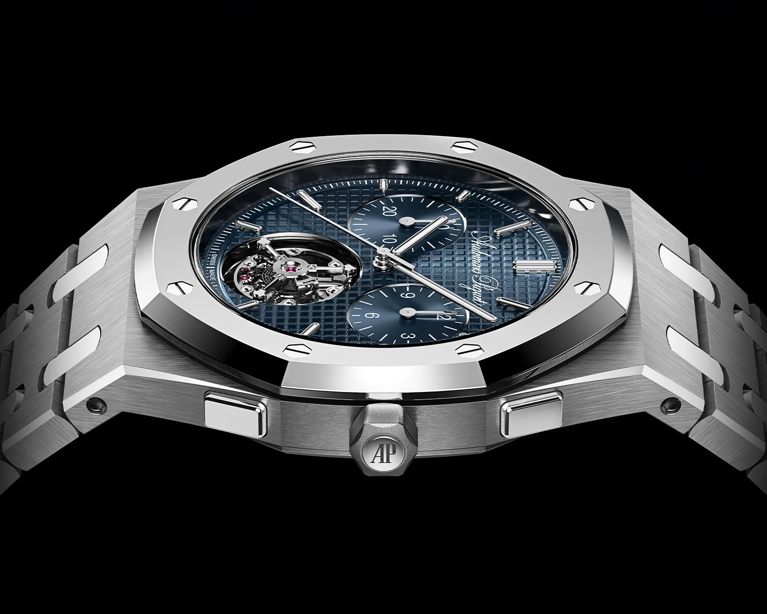 Silver Audemars Piguet watch with blue textured dial and visible tourbillon on black background.