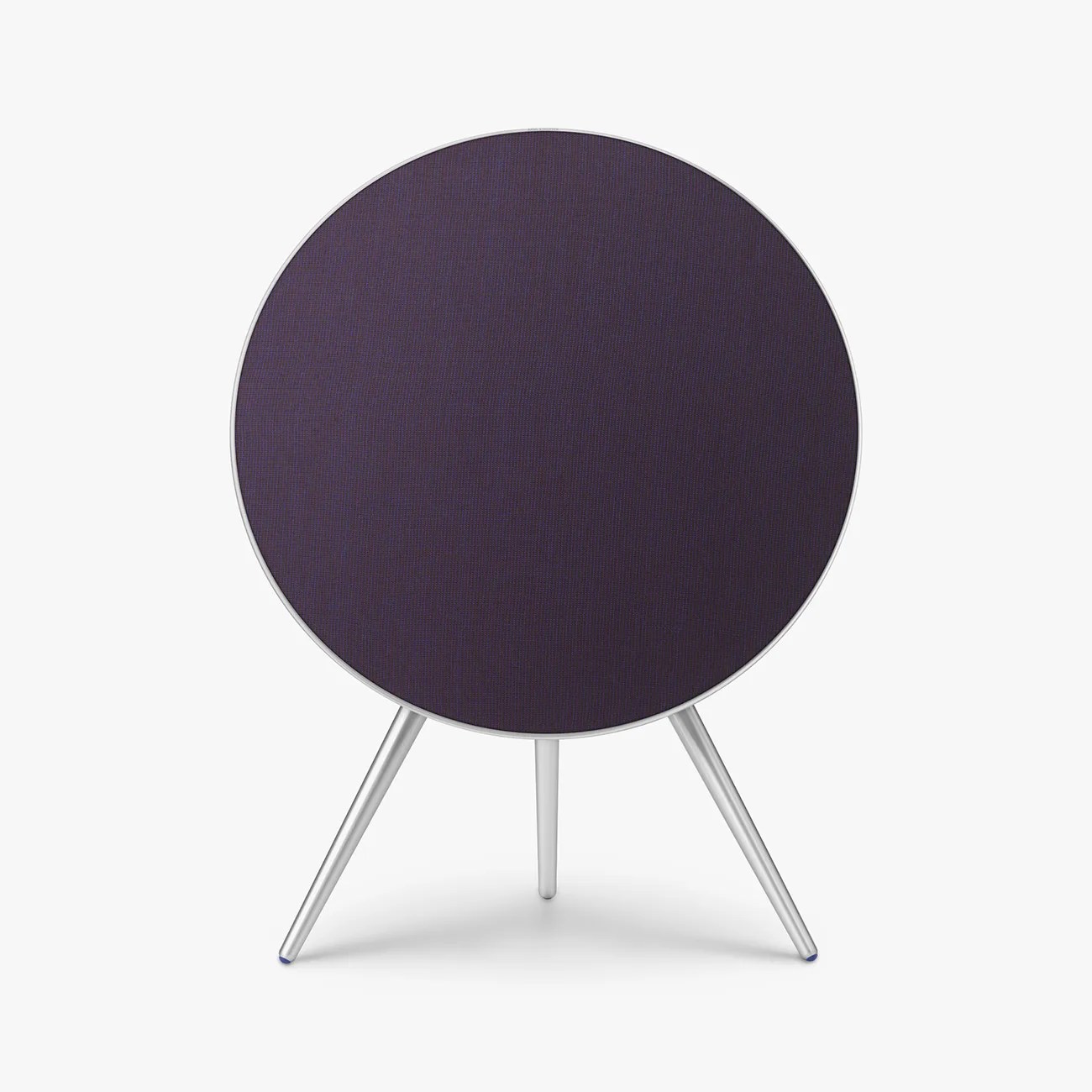 Round dark purple fabric speaker with silver tripod legs on a white background.