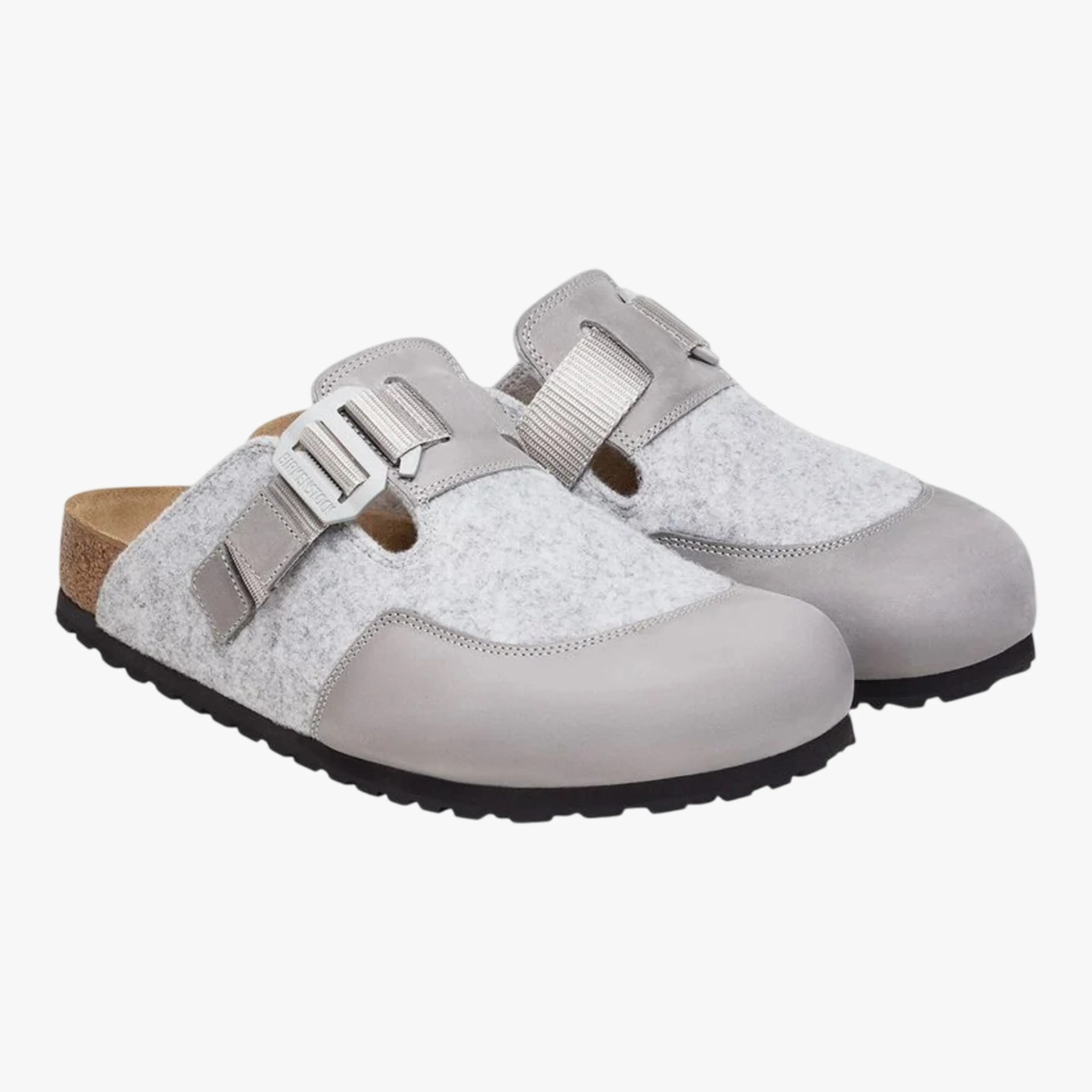 Pair of light gray slip-on clogs with felt upper, adjustable strap, and black rubber sole.