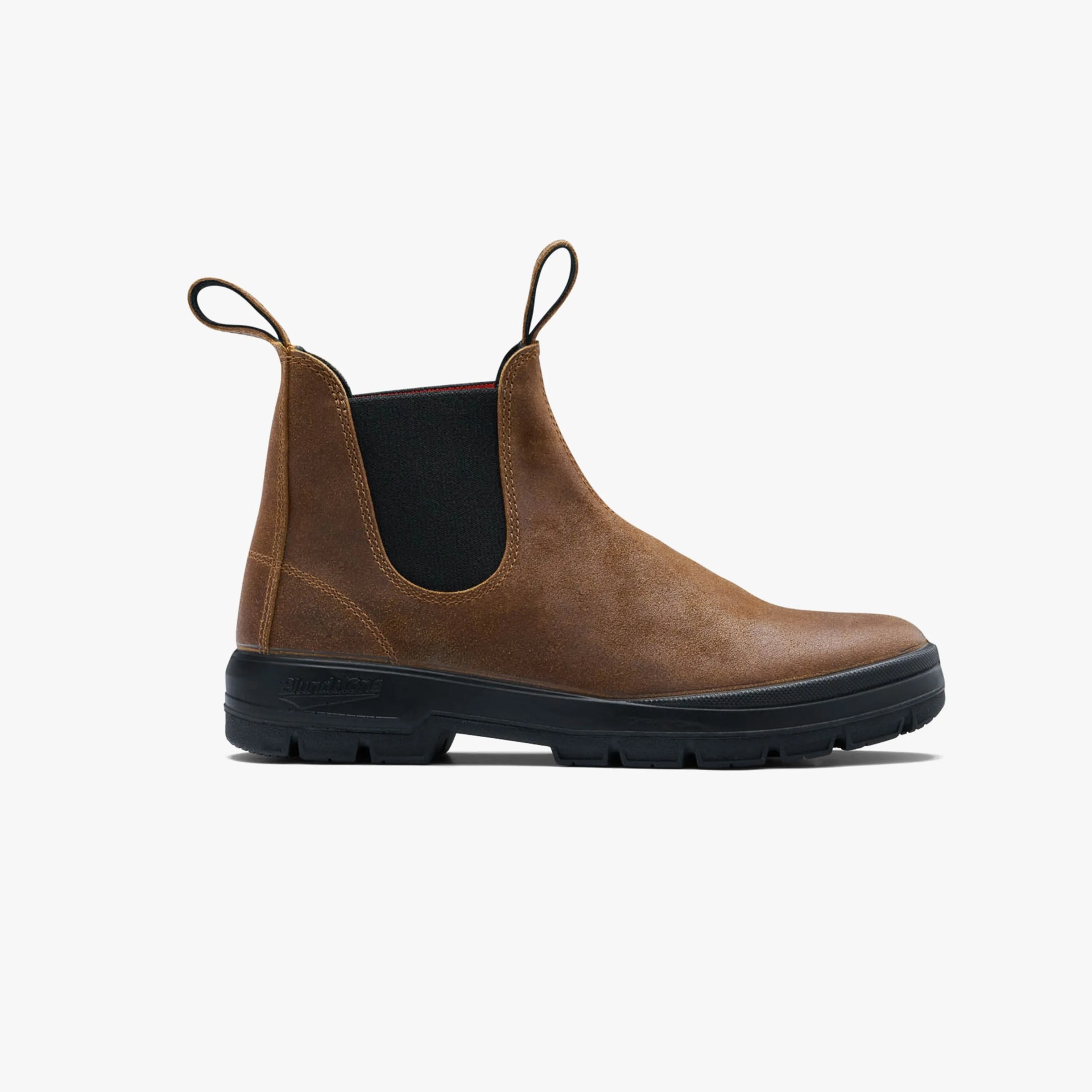 Brown suede Chelsea boot with black elastic side panels and black rubber sole.