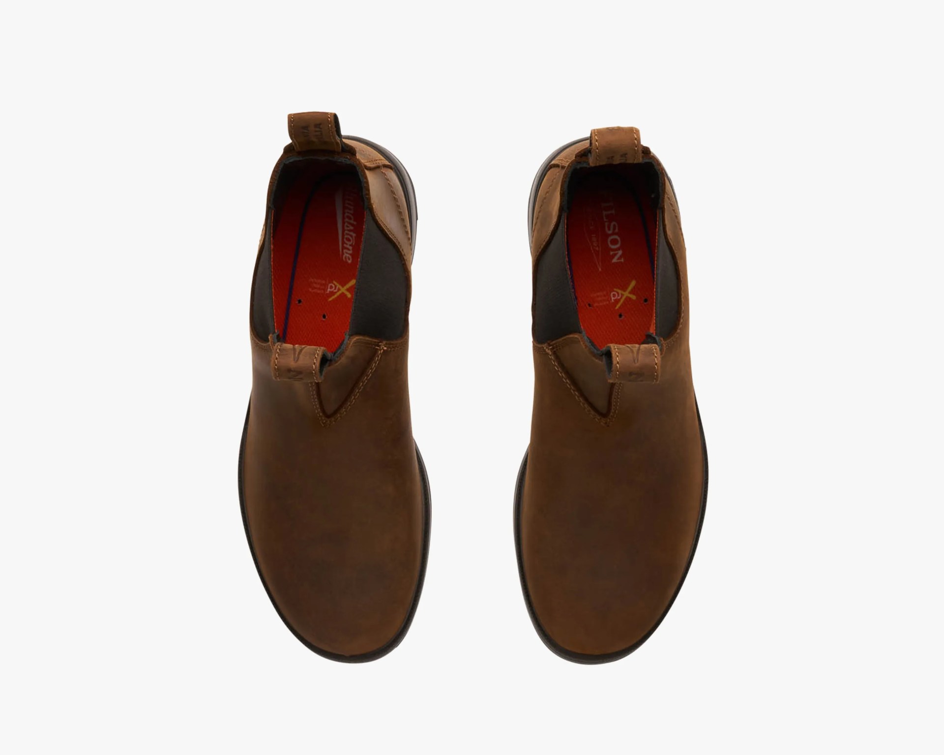 Pair of brown leather slip-on boots with black elastic side panels and red insoles, viewed from above.
